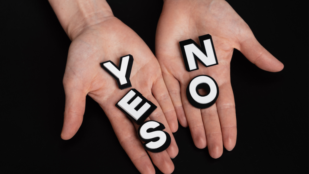 Hands holding letters that say Yes and No | OpenAsset