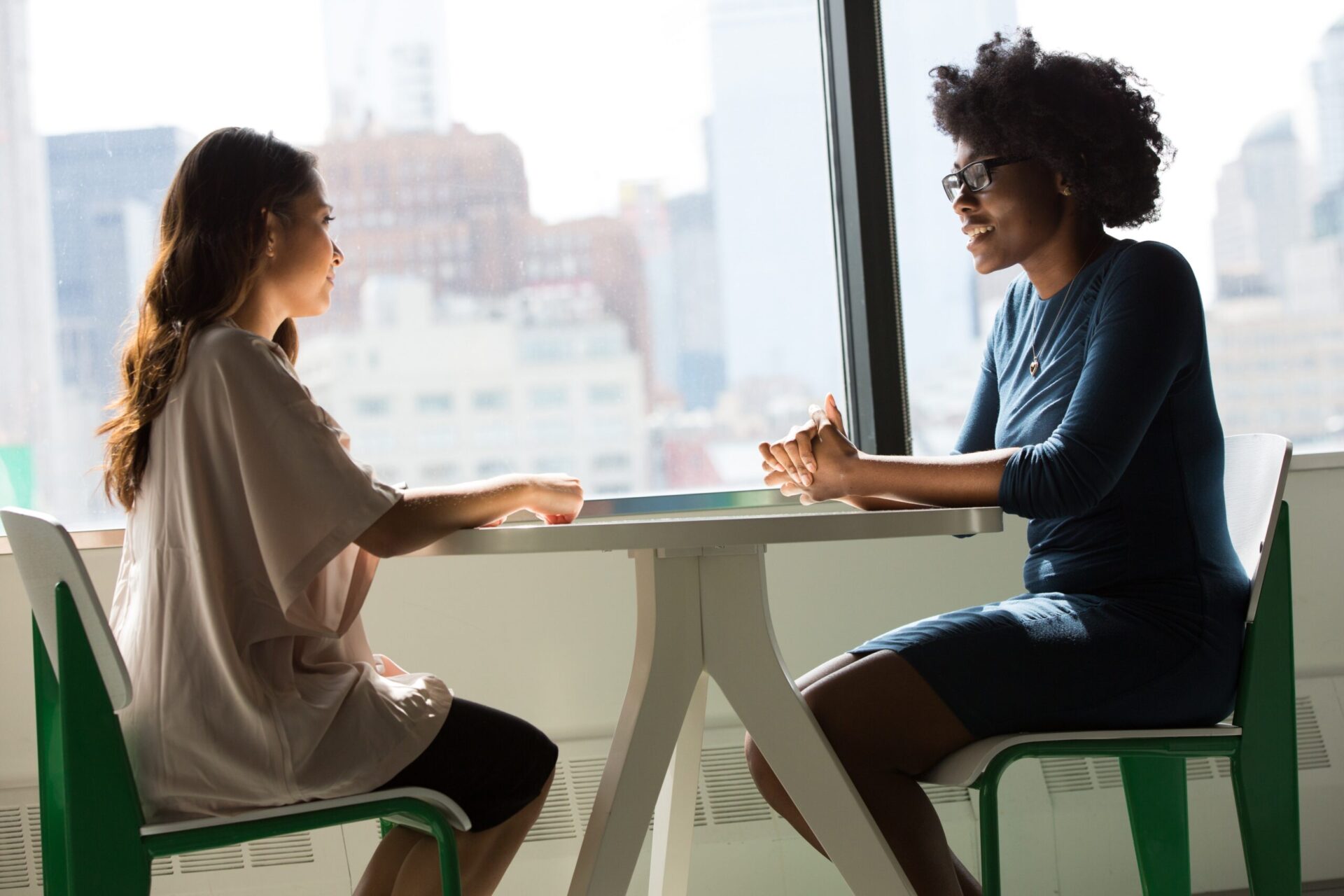 Two woman having a productive meeting | OpenAsset